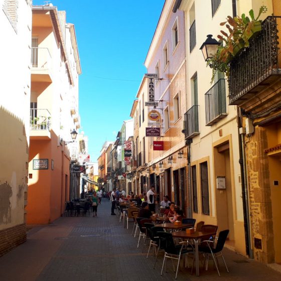 Denia old town street lined with tapas restaurants